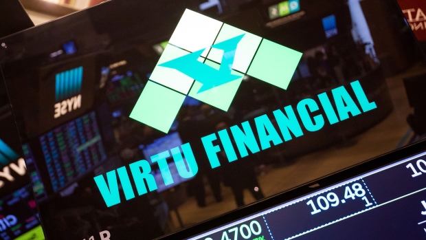 Virtu Financial Inc. signage is displayed above the company's booth on the floor of the New York Stock Exchange. Photographer: Michael Nagle/Bloomberg