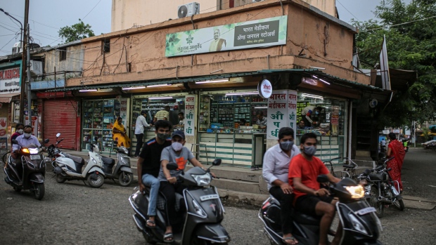 A medical store remains open as other shops at a market are closed due to lockdown restrictions in Jalgaon, Maharashtra, India, on Monday, July 19, 2021. More than two-thirds of India's population had antibodies against Covid-19, leaving a large chunk of its 1.4 billion people still vulnerable, a new national sero-survey has found. Photographer: Dhiraj Singh/Bloomberg