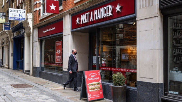 A pedestrian enters a Pret A Manger Ltd. on Bow Lane in London, U.K., on Monday, July 12, 2021. In a news conference on Monday, U.K. Prime Minister Boris Johnson is widely expected to confirm that mandatory curbs will end as planned as England approaches so-called "Freedom Day" on July 19.