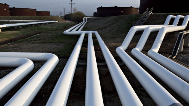 Pipelines run near oil storage tanks in Cushing, Oklahoma. Photographer: Daniel Acker/Bloomberg