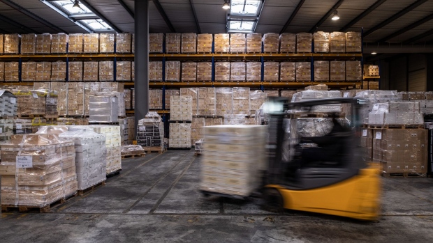 A forklift truck moves pallets stacked with wine inside a JF Hillebrand Group AG wine storage and transit logistics warehouse in Blanquefort, France, on Friday, Sept. 27, 2019. The U.S. is moving ahead with an investigation into a new French digital tax that could lead to import tariffs on French wine and other goods, despite hopes raised at August's G-7 summit. Photographer: Balint Porneczi/Bloomberg