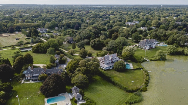 Homes stand in an aerial photograph taken over Southampton, New York, U.S., on Tuesday, Aug. 27, 2019. Would-be buyers in the Hamptons, the beachfront playground for New York City's well-heeled, have been treading cautiously, stymied by everything from tax changes to the vagaries of Wall Street employment and compensation.