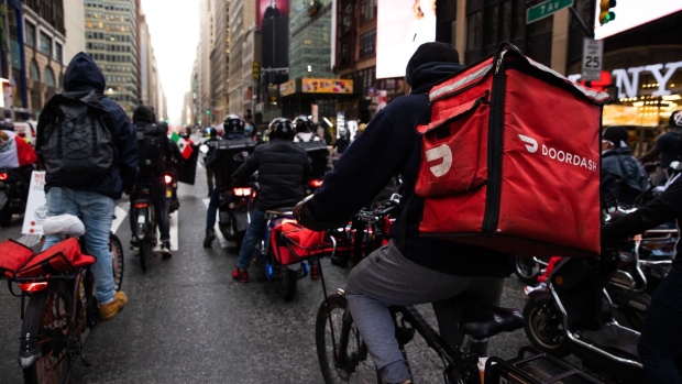 Demonstrators ride down 7th Avenue during a march for food delivery workers rights in New York, on April 21. Photographer: Paul Frangipane/Bloomberg