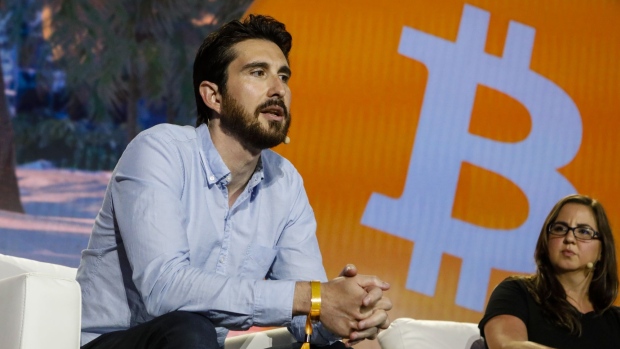 Marco Santori, chief legal officer of Kraken LLC, left, speaks during the Bitcoin 2021 conference in Miami, Florida, U.S., on Friday, June 4, 2021. The biggest Bitcoin event in the world brings a sold-out crowd of 12,000 attendees and thousands more to Miami for a two-day conference.