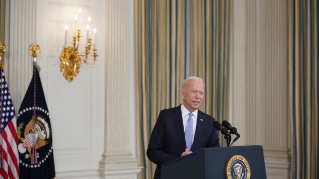 U.S. President Joe Biden speaks in the State Dining Room of the White House in Washington, D.C., U.S., on Friday, Sept. 24, 2021. The U.S. will begin giving Covid-19 booster shots to millions of Americans today, a watershed moment in the nation's battle against the pandemic that officials hope will beat back another brutal winter wave of infections. Photographer: Al Drago/Bloomberg