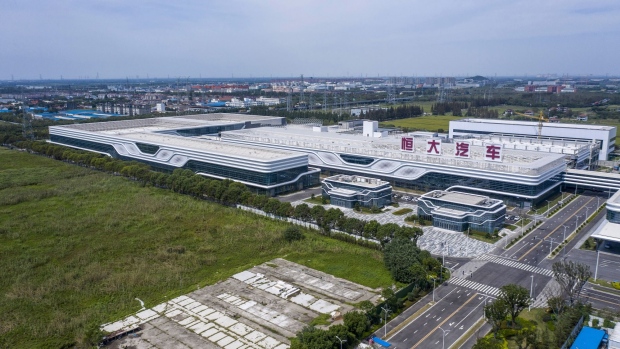 The China Evergrande New Energy Vehicle Group Ltd. factory in Shanghai, China, on Friday, Sept. 24, 2021. China Evergrande Group's electric-car unit missed salary payments to some of its employees and has fallen behind on paying a number of suppliers for factory equipment, according to people familiar with the matter, evidence the stricken property developer's debt woes are having an impact beyond its core business. Photographer: Qilai Shen/Bloomberg
