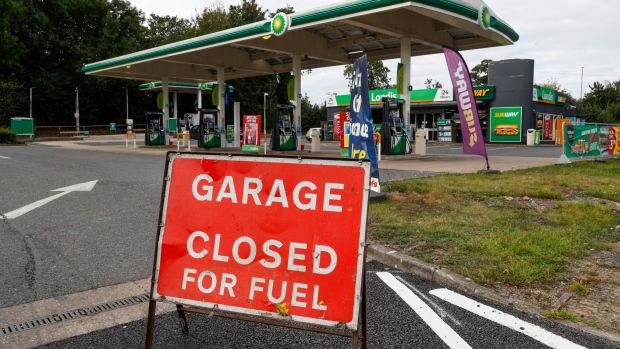 A sign reading 'Garage Closed For Fuel' outside a BP Plc petrol station in Loughborough, U.K., on Friday, Sept. 24, 2021. The U.K. government was in the spotlight Friday, confronted by the twin threats of soaring energy bills and the non-delivery of fuel to some retail filling stations.