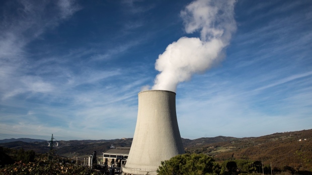 Vapour rises from a cooling tower at a geothermal power station operated by Enel Green Power SpA, a unit of Enel SpA, in Sasso Pisano, Italy, on Thursday, Nov. 29, 2018. Montieri, a village in the verdant Tuscan foothills, burns little coal or natural gas instead the local power plant harnesses steam rising naturally from hot springs deep underground to generate electricity. Photographer: Alessia Pierdomenico/Bloomberg