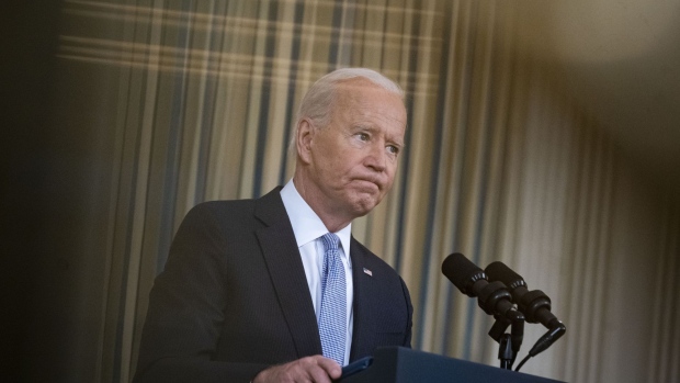 U.S. President Joe Biden pauses while speaking in the State Dining Room of the White House in Washington, D.C., U.S., on Friday, Sept. 24, 2021. The U.S. will begin giving Covid-19 booster shots to millions of Americans today, a watershed moment in the nation's battle against the pandemic that officials hope will beat back another brutal winter wave of infections.