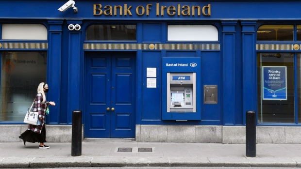A pedestrian wearing a protective face mask passes a Bank of Ireland Plc bank branch in Dublin, Ireland, on Monday, Aug. 10, 2020. Ireland is one of the most open countries in the world in economic terms, according to the KOF Globalisation Index, having built its economic strategy on a low corporate tax rate and a plentiful supply of well-educated, English-speaking workers. Photographer: Aidan Crawley/Bloomberg