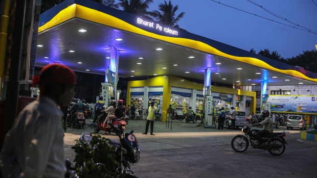 Motorists approach s a Bharat Petroleum Corp. petrol station in Chennai, India, on Thursday, July 1, 2021. India is geared to tackle a possible new wave of Covid-19 infections, according to the country's largest private health care chain which added medical equipment, acquired hotel rooms and trained its staff amid the deadly second wave that swamped country's hospitals and crematoriums. Photographer: Dhiraj Singh/Bloomberg