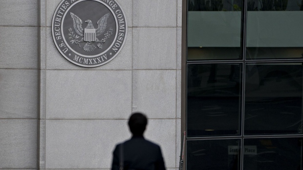A pedestrian walks near the U.S. Securities and Exchange Commission headquarters in Washington, D.C., U.S., on Thursday, Jan. 2, 2020. The federal appeals court in Manhattan today said the government may pursue insider-trading charges under a newer securities-fraud law not subject to a key requirement of the statute prosecutors traditionally use. Photographer: Andrew Harrer/Bloomberg