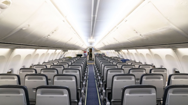The interior of an Alaska Airlines Boeing 737-9 aircraft during an event showcasing the latest updates in the ecoDemonstrator program at Boeing Field in Seattle, Washington, U.S., on Monday, Sept. 27, 2021. Boeing Co. is studying how to incorporate sustainability improvements into aircraft design, production, maintenance and recycling in preparation for its next commercial airliner, said Mike Sinnett, vice president of product development for Boeing Commercial Airplanes. Photographer: David Ryder/Bloomberg