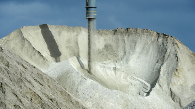 Lithium ore falls from a chute onto a stockpile at a Talison Lithium Ltd. facility, a joint venture between Tianqi Lithium Corp. and Albemarle Corp., in Greenbushes, Australia, on Thursday, Aug. 3, 2017. Rising Chinese demand for lithium-ion batteries needed for electric vehicles and energy storage is driving significant price gains and an asset boom in Australia, already the world's largest lithium producer.