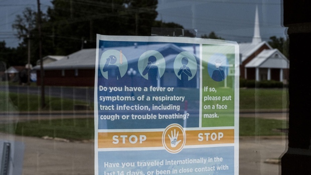 Covid-19 public health signs at a doctor's office in Warren, Arkansas, U.S., on Thursday, Aug. 5, 2021. Photographer: Brad Vest/Bloomberg