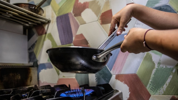 A resident cooks on a domestic gas oven hob in the Molins de Rei district of Barcelona, Spain, on Thursday Sept. 23, 2021. Energy prices are soaring from the U.S. to Europe and Asia as economies emerge from the pandemic and people return to the office.