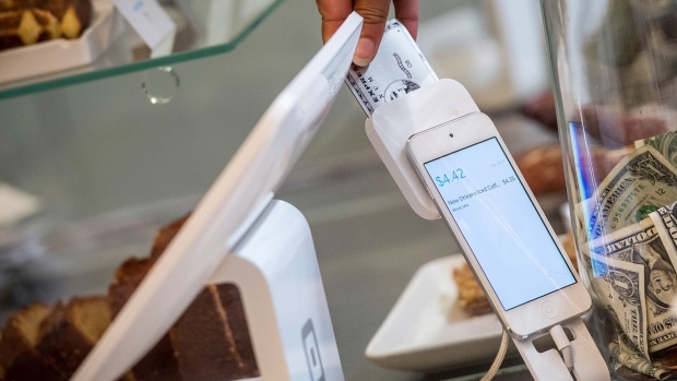A customer inserts a credit card into Square Inc. device while making a payment in San Francisco, California, U.S., on Tuesday, March 27, 2018. The mobile payment market is anticipated to grow reaching a market value of $4,574 billion by 2023, according to data provided by Allied Market Research (AMR). The growth projections are attributed to an increasing demand for hassle-free purchase of goods and services, as well as an increased preference of consumers toward digital and cashless payments. Photographer: Bloomberg/Bloomberg