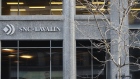 Signage is displayed outside the SNC-Lavalin Group Inc. headquarters in Montreal, Quebec, Canada, on Monday, Feb. 11, 2019. SNC-Lavalin said it failed to reach an agreement with a client in a dispute over a mining project in Latin America, slashing its profit forecast by more than 40 percent for the year and putting its shares on track for the lowest close in a almost a decade.