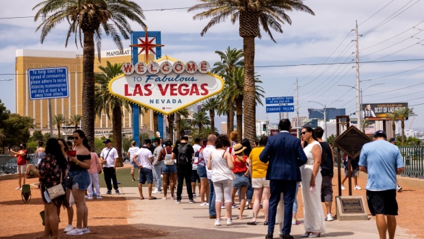 Tourists wait in line to take photographs with the "Welcome to Fabulous Las Vegas" sign in Las Vegas, Nevada, U.S., on Saturday, May 1, 2020. Anthony Fauci, the top infectious-disease official in the U.S., has said that vaccinating 70% to 85% of the U.S. population would enable a return to normalcy. Photographer: Roger Kisby/Bloomberg