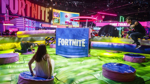 Attendees play in a life sized jump royale game at the Epic Games Inc. Fortnite video game booth during the E3 Electronic Entertainment Expo in Los Angeles, California, U.S., on Tuesday, June 11, 2019. For three days, leading-edge companies, groundbreaking new technologies and never-before-seen products are showcased at E3. Photographer: Patrick T. Fallon/Bloomberg