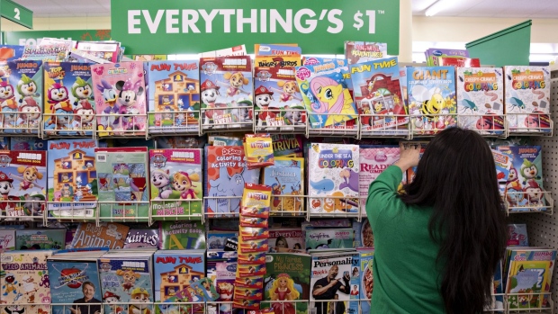 An employee arranges a display of children's books at a Dollar Tree Inc. store in Chicago, Illinois, U.S., on Tuesday, March 3, 2020. Dollar Tree released earnings figures on March 4.