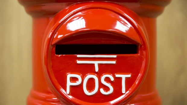 A replica post box is displayed at the Japan Post Holdings Co. headquarters in Tokyo, Japan, on Friday, Jan. 19, 2018. With trillions of unrealized profits, a fat capital buffer and a conservative management style, Japan Post Bank can invest more in risk assets, according to Masatsugu Nagato, president and chief executive officer of Japan Post Holdings Co. Photographer: Tomohiro Ohsumi/Bloomberg