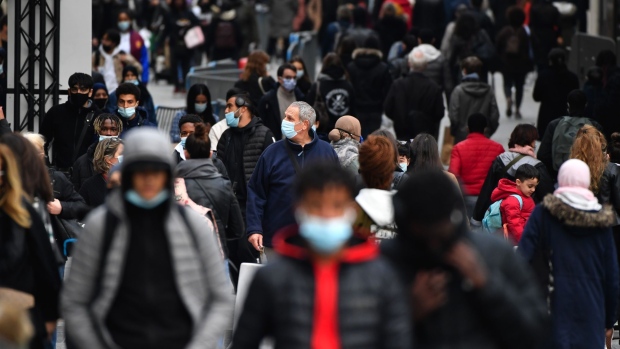 Pedestrians wear protective face masks on a crowded street in Brussels, Belgium, on Friday, Oct. 16, 2020. Belgium’s 14-day incidence rate rose to 550 cases per 100,000 from 494 Thursday, trailing only the Czech Republic as the hardest hit country in Europe. Photographer: Geert Vanden Wijngaert/Bloomberg