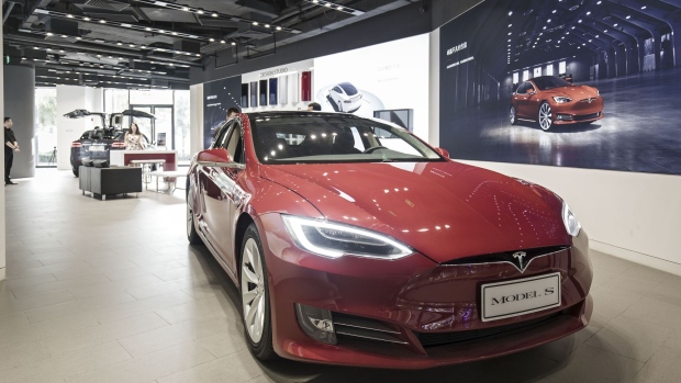 A Tesla Motors Inc. Model S electric vehicle sits on display at the company's showroom in Shanghai, China, on Tuesday, Sept. 12, 2017. China will consider granting foreign investors more access into its electric-vehicle market as the world’s biggest market for battery-powered automobiles comes out with new policy initiatives to give a fillip to the industry. Photographer: Qilai Shen/Bloomberg
