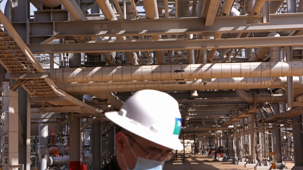 A Saudi Aramco employee at the Khurais Processing Department in the Khurais oil field in Khurais, Saudi Arabia, on Monday, June 28, 2021. The Khurais oil field was built as a fully connected and intelligent field, with thousands of sensors covering oil wells spread over 150km x 40km in order to increase the efficiency of the plant and reduce emississions, according to a Saudi Aramco statement released to the media. Photographer: Maya Sidiqqui/Bloomberg
