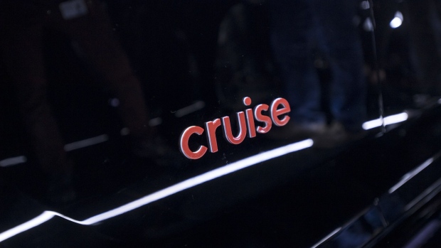 A logo of Cruise Origin electric driverless shuttle sits on the vehicle during a reveal event in San Francisco, California, U.S., on Tuesday, Jan. 21, 2020. The shuttle is designed to be more spacious and passenger-friendly than a conventional, human-driven car. The silver, squared-off vehicle lacks traditional controls like pedals and a steering wheel, freeing up room for multiple people to share rides, Cruise Chief Executive Officer Dan Ammann said at the event. Photographer: David Paul Morris/Bloomberg