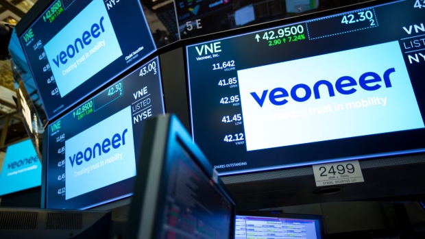 Monitors display Veoneer Inc. signage during the company's first day of trading on the floor of the New York Stock Exchange (NYSE) in New York, U.S., on Monday, July 2, 2018. U.S. stocks fell on lower than normal volume as investors waved off stronger than expected manufacturing numbers and focused on fears of increasing global trade tensions. Photographer: Michael Nagle/Bloomberg