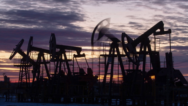 Oil pumping jacks at sunset. Photographer: Andrey Rudakov/Bloomberg