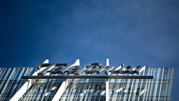 A logo sits on display outside the Telefonica-Diagonal Zero tower, headquarters of Telefonica Digital in Barcelona, Spain, on Tuesday, March 26, 2013. Telefonica, seeking to reduce net debt by more than 4 billion euros this year, is following companies such as Repsol SA, Spain's biggest oil company, and builder Actividades de Construccion & Servicios SA, to sell treasury shares. Photographer: Bloomberg/Bloomberg