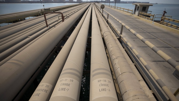 Signs for kerosene and crude oil sit on pipes used for landing and unloading crude and refined oil at the North Pier Terminal, operated by Saudi Aramco, in Ras Tanura, Saudi Arabia, on Monday, Oct. 1, 2018. Saudi Aramco aims to become a global refiner and chemical maker, seeking to profit from parts of the oil industry where demand is growing the fastest while also underpinning the kingdom’s economic diversification. Photographer: Simon Dawson/Bloomberg