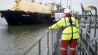 An employee looks towards the Gallina liquefied natural gas (LNG) tanker after docking at the National Grid Plc's Grain LNG plant on the Isle of Grain in Rochester, U.K., on Saturday, March 4, 2017. The shipment to England on the Gallina was priced using the U.K.'s National Balancing Point, where front-month gas cost about $7 a million British thermal units on Feb. 7. Photographer: Bloomberg/Bloomberg