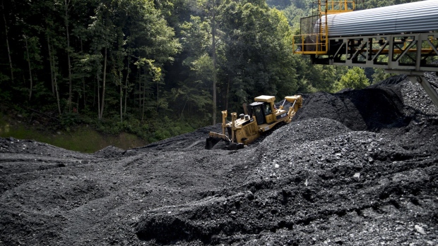 A Caterpillar Inc. D10T dozer pushes raw coal at the newly opened Ramaco Resources Inc. Stonecoal Alma mine near Wylo, West Virginia, U.S., on Tuesday, Aug. 8, 2017. From 2008 to 2016 production from West Virginia’s southern coalfields fell from 117 million tons to 36.6 million, now, the trend is reversing. With prices tripling over the last year for metallurgical coal, which is used in steel-making and hard to find elsewhere in North America, through mid-April of this year, coal output rose 9 percent in southern West Virginia compared with a year ago, according to the U.S. Energy Information Administration. Photographer: Andrew Harrer/Bloomberg