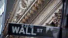 A Wall Street street sign in front of the New York Stock Exchange (NYSE) in New York, U.S., on Monday, Sept. 20, 2021. The global stock rout sparked by investor angst over China’s real-estate sector and Federal Reserve tapering deepened on Monday, with U.S. stocks falling more than 2% and European equities tumbling the most in more than two months. Photographer: Michael Nagle/Bloomberg