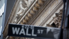 A Wall Street street sign in front of the New York Stock Exchange (NYSE) in New York, U.S., on Monday, Sept. 20, 2021. The global stock rout sparked by investor angst over China’s real-estate sector and Federal Reserve tapering deepened on Monday, with U.S. stocks falling more than 2% and European equities tumbling the most in more than two months. Photographer: Michael Nagle/Bloomberg