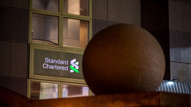 The Standard Chartered Bank building in Hong Kong. Photographer: Paul Yeung/Bloomberg
