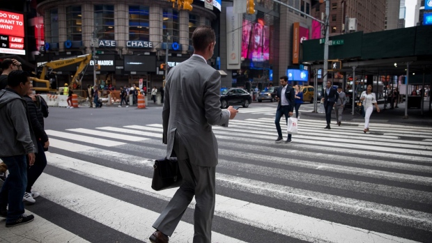 Pedestrians cross West 42nd Street in the Times Square area of New York, U.S., on Friday, Sept. 6, 2019. U.S. stocks advanced and Treasuries were mixed as Federal Reserve Chairman Jerome Powell’s latest comments did little to alter views on Federal Reserve policy. Photographer: Michael Nagle/Bloomberg