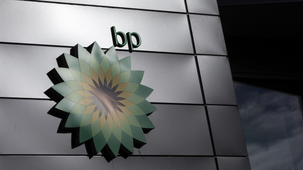 The BP Plc company logo at the entrance to the BP Pulse headquarters in Milton Keynes, U.K., on Tuesday, Feb. 9, 2021. BP aims to cut its oil and gas production by 40%, increase low-carbon spending to $5 billion a year and produce 50 gigawatts of renewable energy by the end of the decade.
