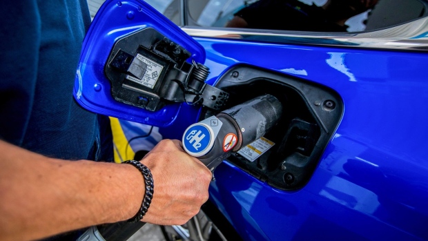 An employee refuels a hydrogen fuel cell electric vehicle in Berlin, Germany, on Aug. 25, 2021. Photographer: Krisztian Bocsi/Bloomberg