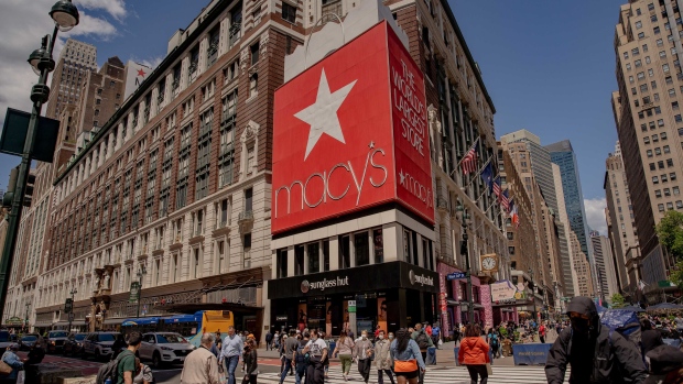 Pedestrians pass in front of Macy's Inc. flagship department store in the Herald Square area of New York, U.S., on Thursday, May 13, 2021. Macy's Inc. is scheduled to release earnings figures on May 18. Photographer: Amir Hamja/Bloomberg
