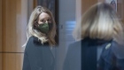 Elizabeth Holmes, founder of Theranos Inc., left, arrives at federal court in San Jose, California, U.S., on Tuesday, Oct. 12, 2021. A lawyer representing Holmes was blocked from taking his best shot at undermining a former Theranos lab director who's been a damning witness at her criminal trial.