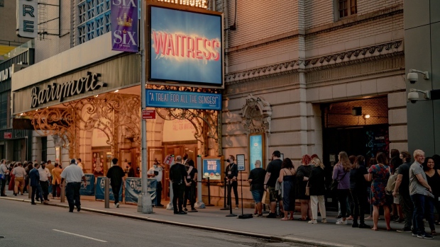 Customers in line to enter the Barrymore Theatre to see the Waitress musical in the Times Square neighborhood of New York, U.S., on Saturday, Sept. 4, 2021. This month, as Broadway theaters, Lincoln Center, and other stages reopen, New Yorkers will see if the city's famous love for the arts has held strong enough to play a starring role in its economic revival. Photographer: Amir Hamja/Bloomberg