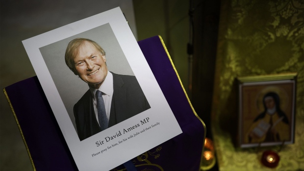 A photograph of UK Conservative MP Sir David Amess at a vigil held at Saint Peter's Catholic Church in Leigh-on-Sea, England on Oct. 15, 2021.