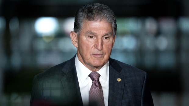 Senator Joe Manchin, a Democrat from West Virginia, speaks to members of the media at the Hart Senate Office building in Washington, D.C., U.S., on Wednesday, Oct. 6, 2021. Democrats and Republicans must decide in the next day or two how far to take their deadlock over the U.S. debt limit, which is pushing the country perilously close to a catastrophic default.