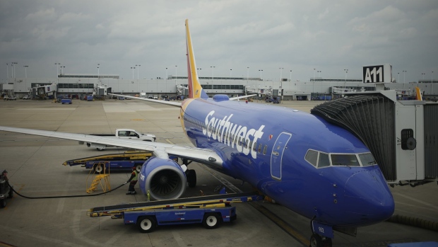 Southwest Airlines Co. Boeing 737 passenger jets parked on the tarmac at Midway International Airport (MDW) in Chicago, Illinois, U.S., on Monday, Oct. 11, 2021. Southwest Airlines Co. disruptions moved into a fourth day, with 355 canceled flights, or 10% of its daily schedule, on Monday, the latest in a series of setbacks at the carrier. Photographer: Luke Sharrett/Bloomberg