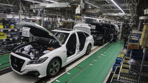 Toyota Motor Crop. Crown vehicles stand on production line at the company's Motomachi plant in Toyota city, Aichi, Japan, on Thursday, July 26, 2018. Toyota may stop importing some models into the U.S. if President Donald Trump raises vehicle tariffs, while other cars and trucks in showrooms will get more expensive, according to the automaker’s North American chief. Photographer: Shiho Fukada/Bloomberg