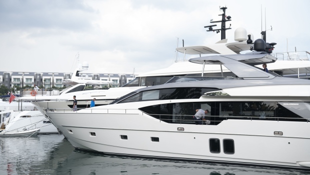 People work onboard a Sanlorenzo SD 126 yacht, manufactured by Sanlorenzo SpA, ahead of the Singapore Yacht Show at Sentosa Cove in Singapore, on Tuesday, April 9, 2019. Almost 90 yachts and other water vessels are on display at the Singapore Yacht Show, which is hoping to attract more than 16,000 people — from experienced yacht buyers to those still striving. Photographer: Wei Leng Tay/Bloomberg